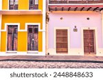 San Juan, Puerto Rico - March 26, 2024: Rustic building entrances and doors along the side streets in the old town of San Juan, Puerto Rico
