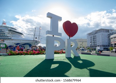 San Juan, Puerto Rico - March 26, 2019.  At the Cruise ship port in San Juan, Puerto Rico stands an "I Love PR" statue for tourist to stand with for a photo Op.