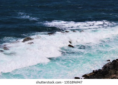 San Juan, Puerto Rico, USA - 3 April 2017:  View Of The Caribbean Sea Crashing Waves From El Morro National Monument.  The Waves Are Strong And Are Constantly Falling Upon The Protection Barrier.