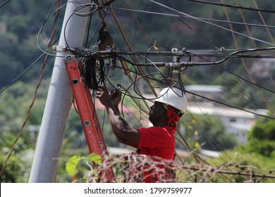 San Juan, Trinidad - 3 Aug 2020:  The Cable Guy Installing Cable In The Area