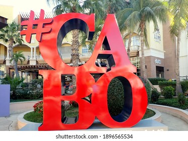 San Lucas del Cabo, Baja California Sur, Mexico - December, 30, 2020: sign for Los Cabos in a touristy area. Giant red letters CABO with hashtag. No people.