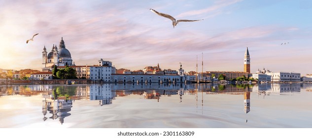 San Marco and Doge's Palace in the Venice lagoon at sunset, panoramic view, Italy - Powered by Shutterstock