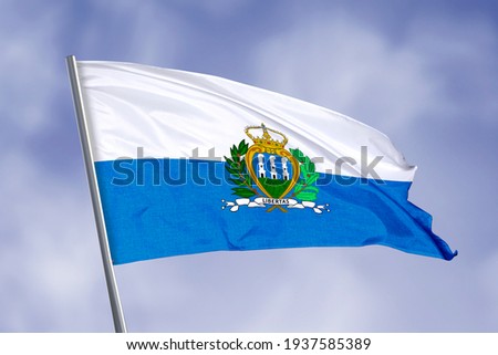 San Marino flag isolated on sky background. close up waving flag of San Marino. flag symbols of San Marino.