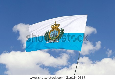 San Marino flag is isolated on the blue sky with a clipping path. flag symbols of San Marino.