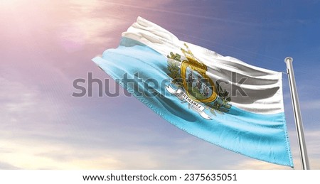 San Marino national flag waving in beautiful sky. The flag waving with dynamic angle.
