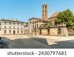 San Martino square with view of the bell tower of the Church of Saints Giovanni end Reparata, in the oldest part of the historic center of Lucca, Tuscany, Italy