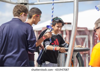 SAN MATEO, CA May 20 2016 - A Boy And His Friends Operate An Interactive Art Piece During The 11th Annual Bay Area Maker Faire At The San Mateo County Event Center.