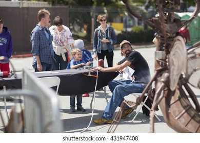 SAN MATEO, CA May 20 2016 - A Young Boy Operates An Interactive Art Piece During The 11th Annual Bay Area Maker Faire At The San Mateo County Event Center.