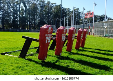 SAN MATEO, CA / USA - JANUARY 2020: High School Football Equipment Stands At The Ready For Practice To Begin.