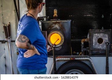 SAN MATEO CALIFORNIA, USA - JUNE 8, 2019: Woman Giving A Public Glassblowing Demonstration At Local Carnival