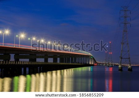The San Mateo-Hayward Bridge and Electricity Towers via Foster City, California