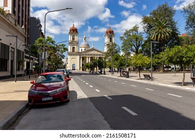 San Miguel de Tucuman, Tucuman, Argentina. 02-13-2022 - in the background the city church, deserted streets, parked car, a square.