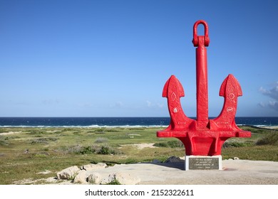 SAN NICOLAS, ARUBA - DECEMBER 17, 2020: The red anchor historical landmark in memory of all seamen lost at sea, located on the southeastern coast of Aruba (Selective Focus, Focus on the anchor)