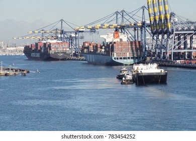 SAN PEDRO, CALIFORNIA - DEC 6, 2017 - Container Ship And Overhead Cranes On The Dock Of Long Beach Port, San Pedro, California