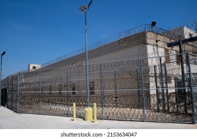 San Pedro California Federal Correctional Institution Terminal Island prison exterior. Prison fence and razor wire 