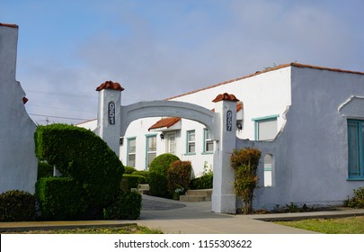 San Pedro, California USA - August 12, 2018: Arched Entryway To A Bungalow Court Apartment Complex In Spanish Style Shows The Community Area Between Units