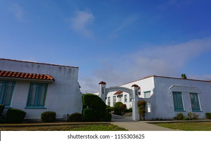 San Pedro, California USA - August 12, 2018: A Classic California Bungalow Court Apartment Complex In Spanish Revival Style With A Distinctive Arched Courtyard Entrance