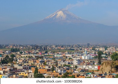 San Pedro Cholula and Popocatepetl volcano seen from Shrine of Our Lady of Remedies, Mexico