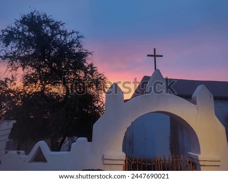 San Pedro de Atacama desert, Antofagasta, Chile. February, 12, 2024. Sunset at old San Pedro Church, a colonial adobe walled church dating from the 17th century, ancient building in the main square