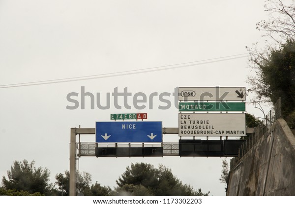 San Remo, Italy -\
24 February, 2018.\
Road information boards.\
View from the car on\
the roads and the city.