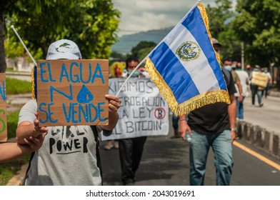 San Salvador, El Salvador - September 15th, 2021: Protesters Walk In The Streets Of The City Against The Bitcoin And Water Rights Policies Of Current President Nayib Bukele.