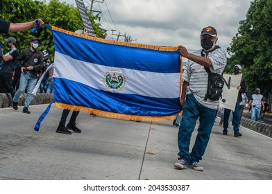 San Salvador, El Salvador - September 15th, 2021: Protesters Hold National Flags And March Against The Politics Of Current President Nayib Bukele.