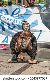 San Salvador, El Salvador - September 15th, 2021: Protesters Burn A Piñata With The Face Of Current President Nayib Bukele.