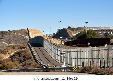 SAN YSIDRO, CALIFORNIA - NOVEMBER 26, 2018: The USA Mexico Border Wall seen from International Friendship Park on the US side looking towards Tijuana. - Shutterstock ID 1241666524