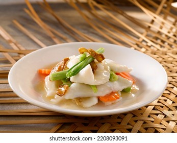 San Yu Fish Slices With Spring Onion And Ginger Served In A Dish Isolated On Table Side View