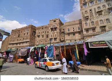 Sanaa, Yemen - March 6, 2010: Typical street in old city of Sanaa. Inhabited for more than 2.500 years at an altitude of 2.200 m, the Old City of Sanaa is a UNESCO World Heritage City. 