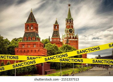 Sanctions caution tape at Moscow, Russia. Warning information on Kremlin background. Concept of restrictions of Russia, world crisis, Russian economy, politics, tension, russophobia and geopolitics. - Powered by Shutterstock