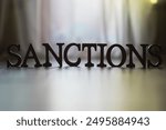 SANCTIONS Concept Word on Blurred Background Reflecting Policy and Economic Restrictions