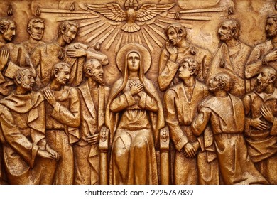 Sanctuary of Fatima.  Golden bas-relief of the old Basilica of Fatima representing one of the fourteen mysteries of the rosary, similar to the stations of the cross. The Descent of the Holy Spirit. - Shutterstock ID 2225767839