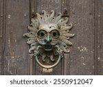 A sanctuary knocker  on the door of a Durham Cathedral. Under medieval English common law, the knocker afforded the right of asylum to anybody who touched them.