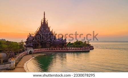 Sanctuary of Truth, Pattaya, Thailand, wooden temple by the ocean during sunset on the beach of Pattaya. Temple of Truth in Thailand drone view from above