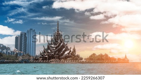 Sanctuary of Truth, Wooden temple construction at sunset in Thai. Sanctuary is an all wood building filled with sculptures based on traditional Buddhist and Hindu motif