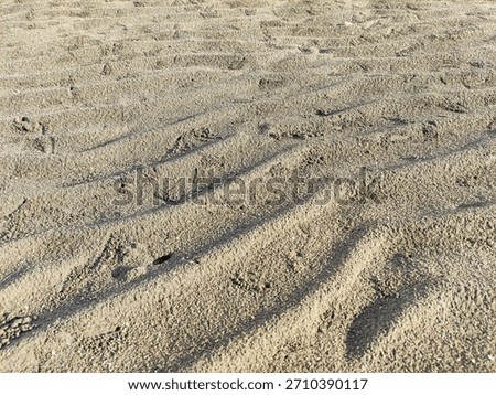sand background, a granular material consisting of finely divided rock and mineral particles.
