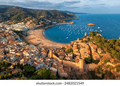 Sand beach and historical fortress in Tossa de Mar, the popular resort town on Costa Brava near Barcelona, Catalonia, Spain - Powered by Shutterstock