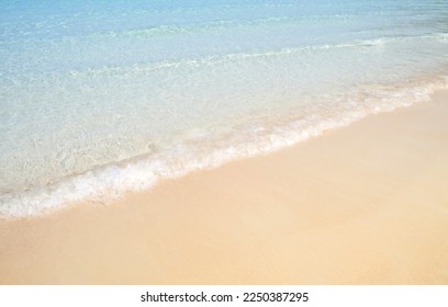 Sand beach sea on sun light with sea wave. - Shutterstock ID 2250387295
