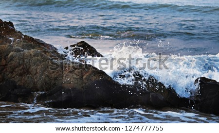 Similar – waves and splashes of sea surf and stones on the seashore in Egypt Dahab South Sinai