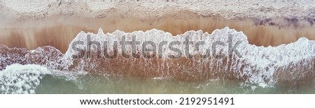 Similar – Foto Bild Luftbild Panoramadrohne Blick auf blaue Meereswellen und schönen Sandstrand in Portugal