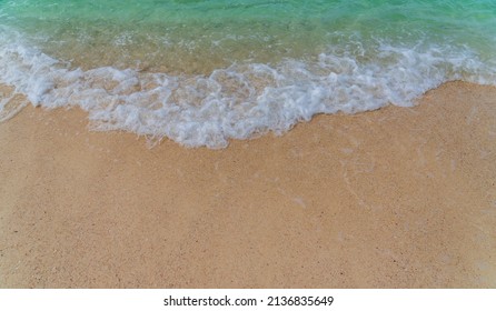 Sand Beach Seaside With White Foamy And Blue Wave From The Sea Shore Overhead 