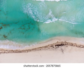 Sand Beach. White Sand. Sea Water And Waves. Turquoise Water Color. Drone Shooting. Abstraction. Texture. There Are No People In The Photo. Minimalism. Rest, Relaxation, Sea Travel.