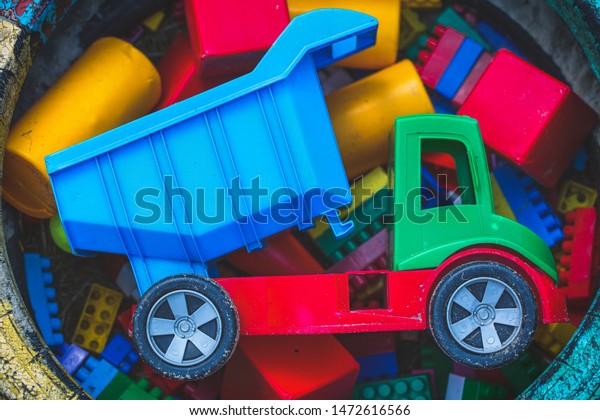 Sand box with color\
toy car and many toys