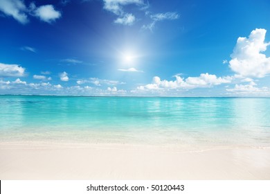 sand and Caribbean sea - Powered by Shutterstock