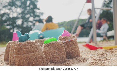 Sand Castles Build By Kids In Public Playground Sandbox