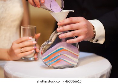 Sand ceremony on wedding, glass vase for bride and groom. Marriage concept