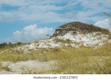 Sand Dune With Clouds And Grass