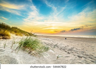 Sand dunes against the sunset light on the beach in northern Poland