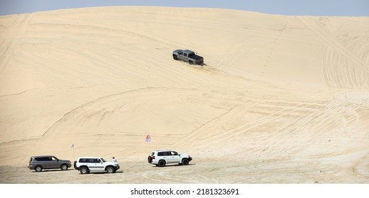 Sand Dunes, Doha, Qatar, Circa 2021: Sports Utility Vehicle (4X4 SUV) On Desert. Desert Driving (dune Bashing) Is Popular Adventure Sport In Qatar. 